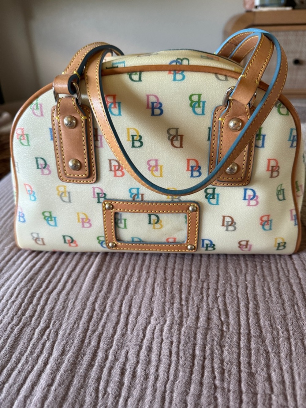 Dooney & Bourke Cream Satchel with Multicolor Logo Accents
